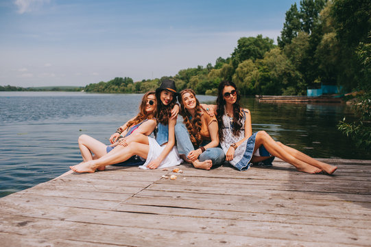 Four Beautiful Girl Friends On The Dock