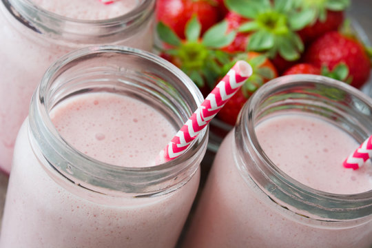 Strawberry smoothie on wooden 
