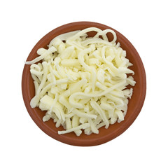 Pizza cheese in a small bowl isolated on a white background top view.