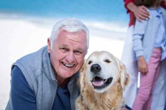 Senior man posing with his dog