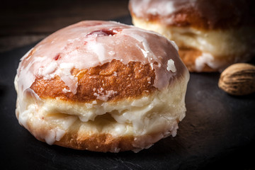 Donut with icing and rose jam.