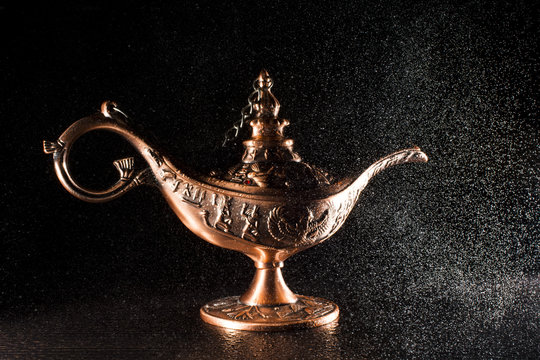 Aladdin's lamp isolated on black  background