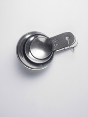 stainless steel measuring spoon on white background