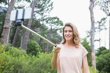 Fototapeta premium Smiling woman taking selfies