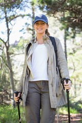 Smiling woman nordic walking