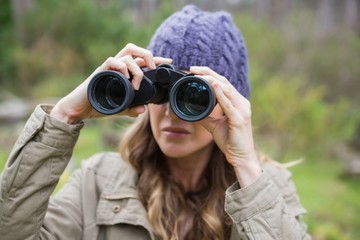 Woman using binoculars