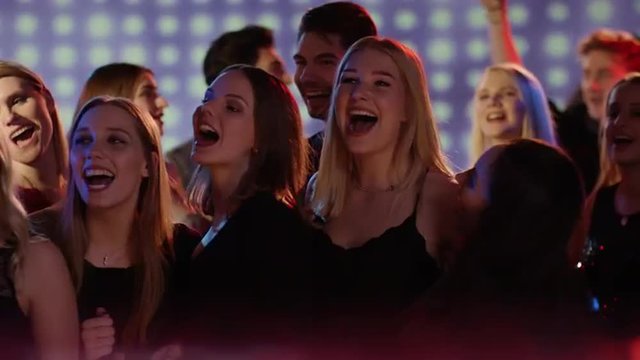attractive young people at club doing countdown