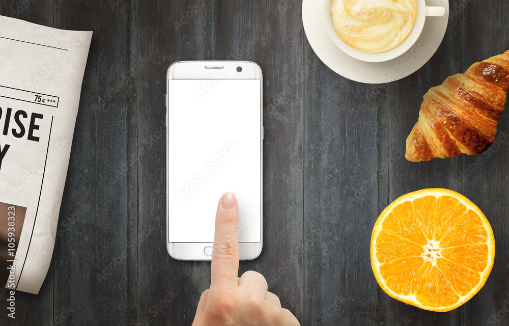 Poster smart phone with isolated display for mockup. hand touching display. newspapers, coffee, croissant a