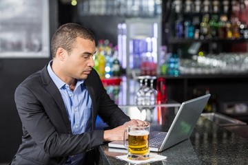 Businessman using his laptop