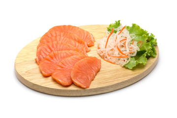 sliced salmon on wood background