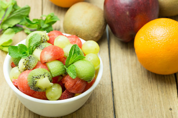 fruit salad with strawberries, oranges, kiwi, grape and watermel