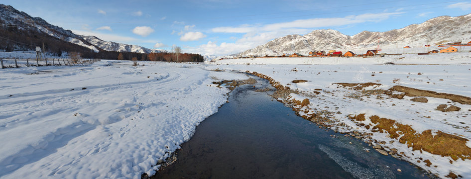Mountain village winter brook