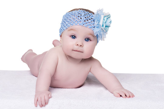 Little Baby Girl With Blue Bow Flower On Her Head