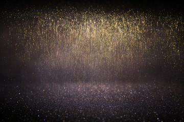 glitter vintage lights background.gold and black. defocused.
