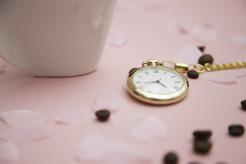 coffee , pocket watch and sakura petals