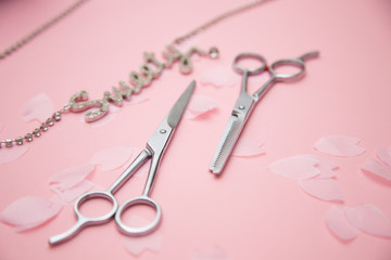 hairdresser scissors and sakura petals