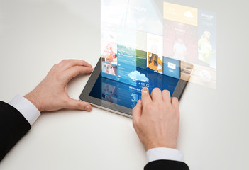 close up of man hands with web pages on tablet pc