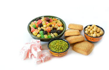 Various delicious ingredients for breakfast. Cookies, lokum, dried fruits, nuts. Isolated on white background