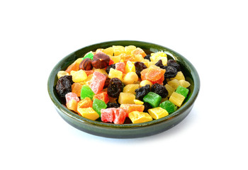 Delicious and healthy mixed dried fruit and  nuts in the bowl.  Isolated on white background