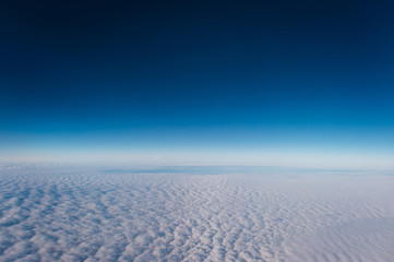 Flight above the clouds with a view of the sky