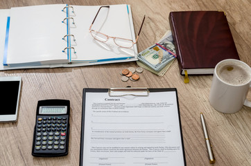 empty contract with office accessories on desk