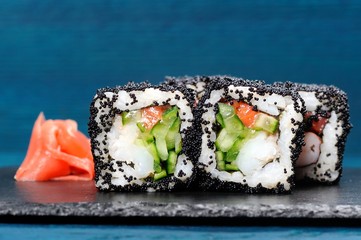Japan black tobiko rolls with cream cheese and cucumber served w