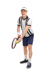 Young tennis player preparing for a serve