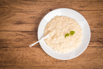 Millet porridge on a wooden background