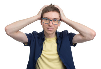 student holding his hands on his head