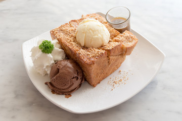 Honey toast with vanilla, chocolate ice-cream, whipped cream and caramel sauce.