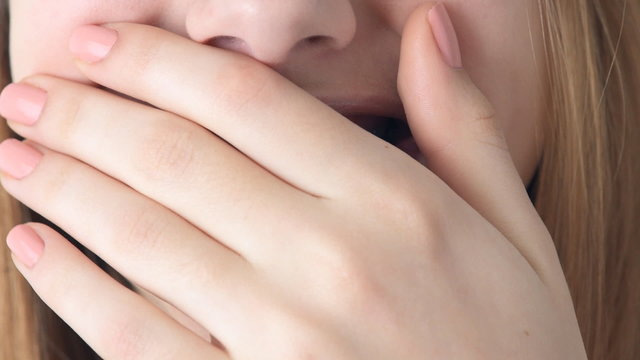 Beautiful smiling girl with retainer for teeth .