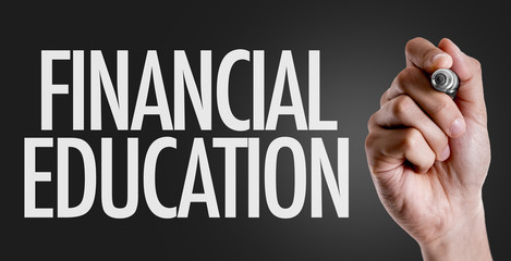 Hand writing the text: Financial Education