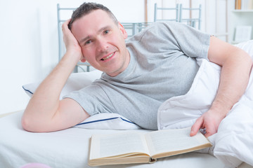 Fototapeta premium Reading book in bed