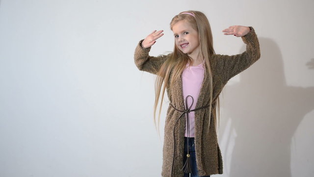 Photographer taking pictures of the child in the studio.