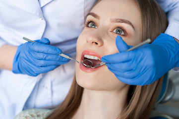 Dentist examining a patient's teeth