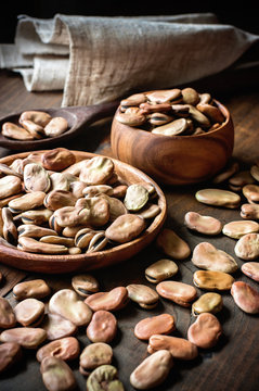 Fava beans in wooden bowls. Rustic style. Toned image. Selective focus
