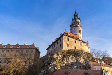 Cesky Krumlov tower view from the wooden bridge in the morning.