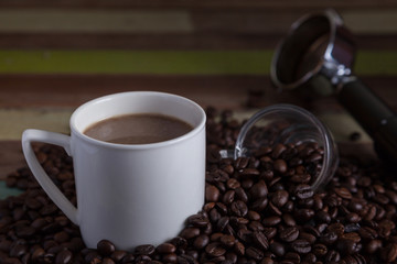 White coffee cup with beans background