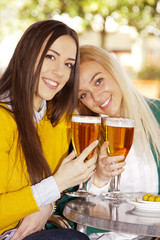 friends with beers on the terrace