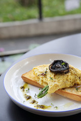 Scrambled eggs with bread asparagus and mushroom