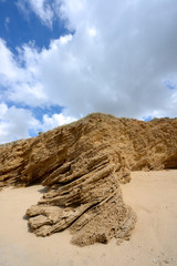Fototapeta na wymiar Rippled sand dunes undercloudy sky
