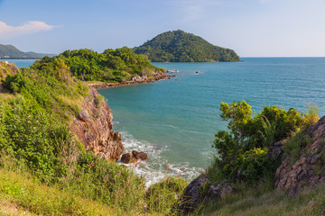 Fototapeta premium Beautiful seascape with small mountain, on blue sky background
