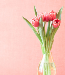 bouquet of tulips in vase, pastel colours, space for text
