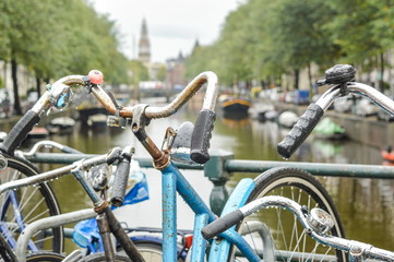 Bicycle parked on a bridge in Amsterdam