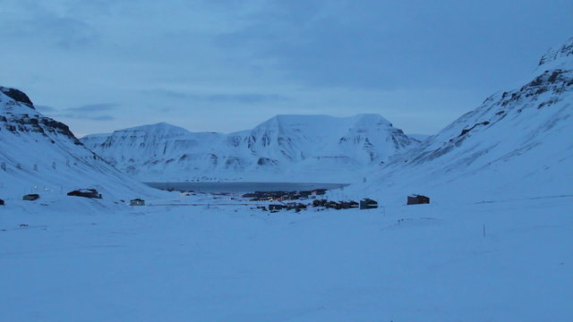 Longyearbyen, Svalbard. The World's Northernmost Inhabited Place. The small town is surrounded by mountains. Polar night in March.