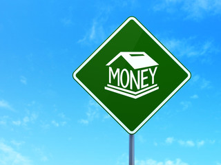 Money concept: Money Box on road sign background