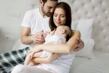 Happy family with newborn baby