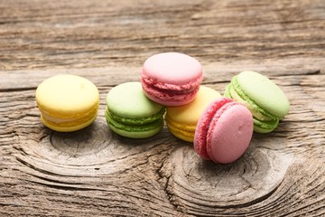 colorful macaroons on wooden table