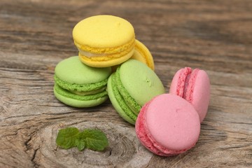colorful macaroons on wooden table