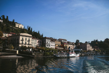 Fototapeta na wymiar view of the city on the shore of a mountain lake Como
